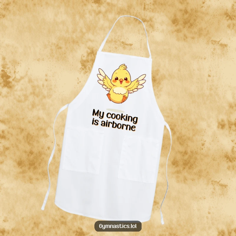 Funny chick in a landing pose with wings spread, featured on a humorous apron for kitchen use.