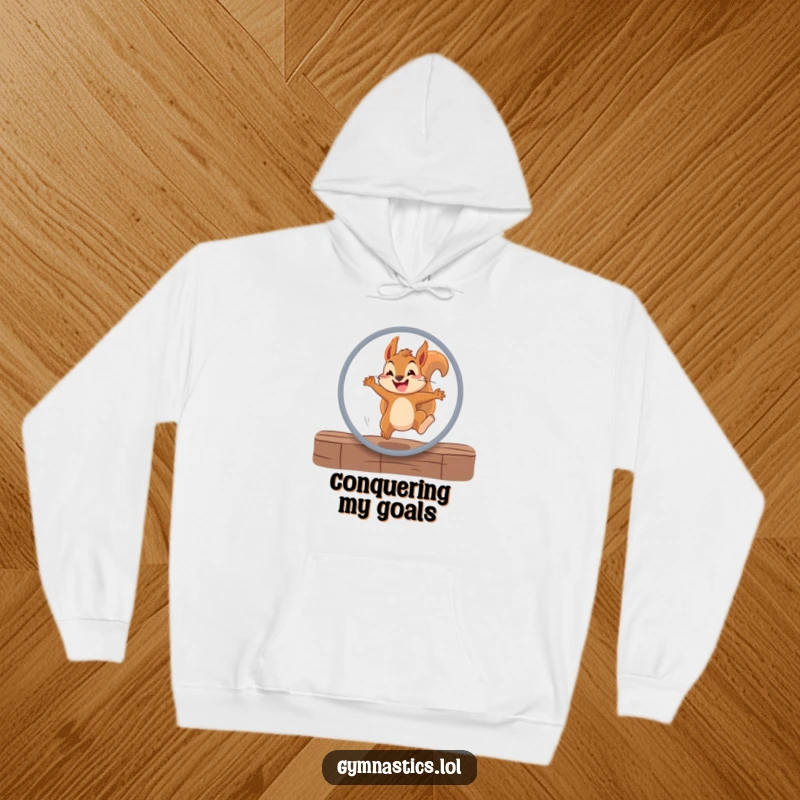 Funny squirrel hoodie showing a determined squirrel leaping through a hoop with a grin, offering warmth and humorous inspiration.