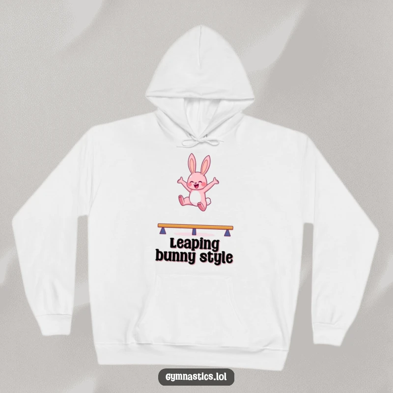 Funny bunny balance beam hoodie featuring a pink bunny leaping high in the air with arms outstretched, perfect for cozy, humorous wear.
