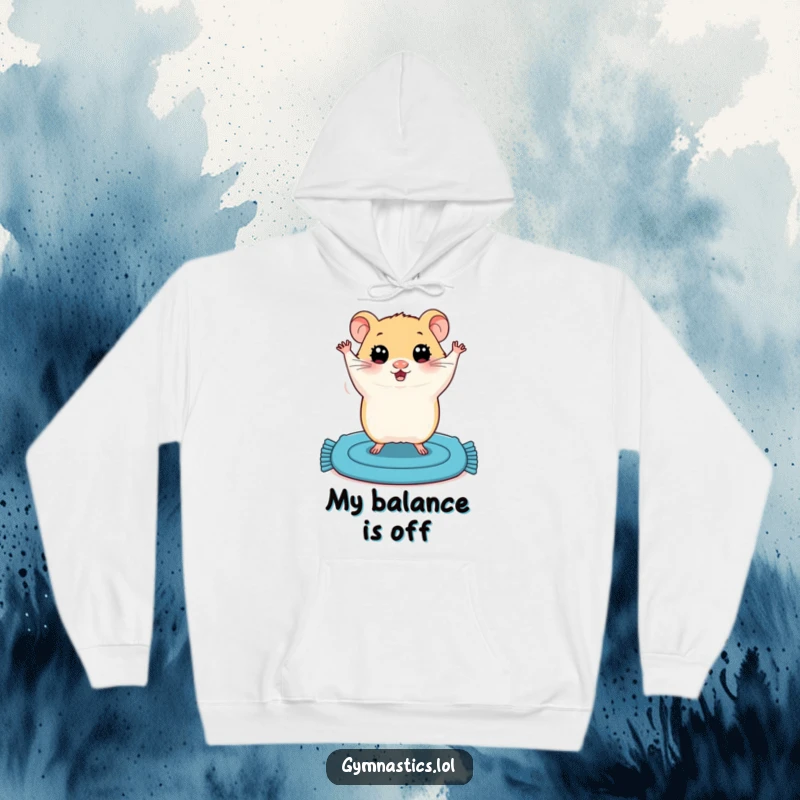 Funny hoodie showcasing a plump hamster with wide eyes attempting a shaky handstand on a blue mat, highlighting adorable clumsiness.