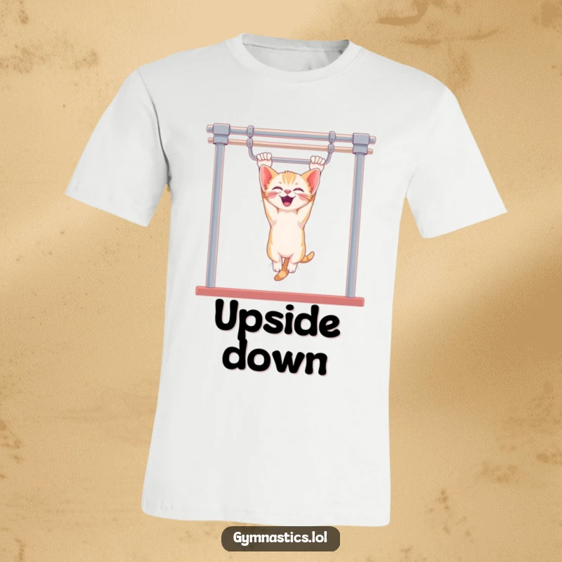 Funny kitten t-shirt featuring a giggling kitten hanging upside down from uneven bars, capturing a moment of pure, unadulterated feline fun.