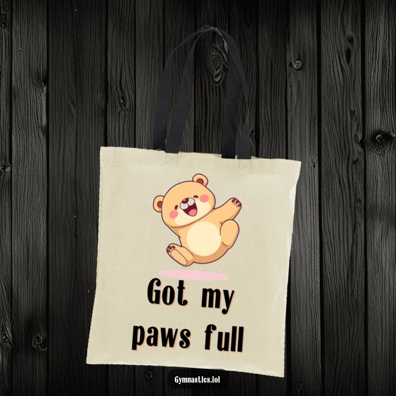 Funny Tote Bag depicting a joyful bear mid-tumble, landing perfectly and gracefully, showcasing a lighthearted and happy scene.